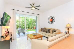 Direct access to the private patio & view of tropical green scenery