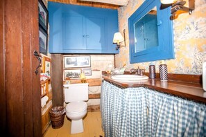 Half bath on the main floor near the living room and kitchen. 