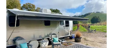 Sleep beneath the stars in the middle of a vineyard in our 25' Safari Airstream!