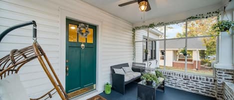 The large, screened-in front porch is the star of the show!