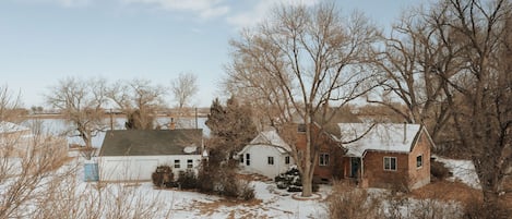 Gorgeous backyard wedding location! Country solitude, 2+ acre estate. 40-acre private lake. 1700 sf vintage farmhouse, 2-car garage, 2-1200sf insulated outbuildings for year round entertainment.