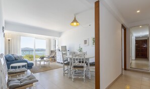 Spacious living-dining area with sea views and Mediterranean style.