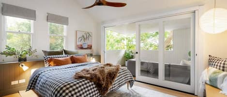 King bed with built-in-robes, ceiling fan, covered balcony and air-conditioning