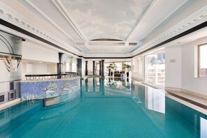Entertainment deck with indoor pool, gym, sauna, harbour bridge and city views