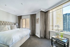 Comfortable Queen size bedroom with built-in-robes, air-conditioning, Block out blinds and Smart TV