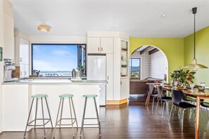 Open plan lounge area with a cool retro vibe, this authentic Austinmer property will provide all of your creature comforts in your home away from home. A large dining table for 8 both inside and out makes it easy for guests to come together. 