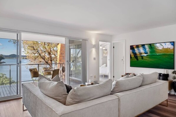 Cosy open plan lounge area, overlooking the water