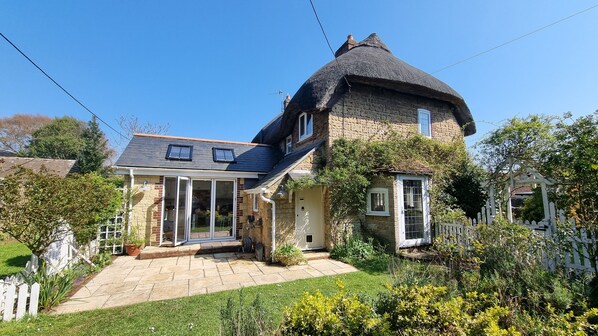 Rear garden with folding doors onto patio