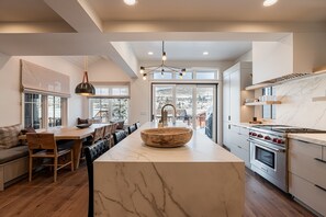 Fully equipped gourmet kitchen featuring and spacious island with seating for four