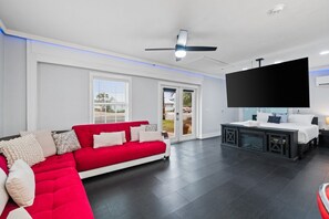 Living Area with Sleeper Sofa and Large Flat Screen TV