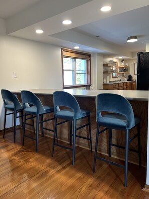 Bar seating between living room and kitchen 