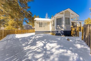 Get cozy in this charming small house nestled in a winter wonderland!
