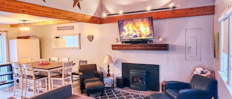 Living room with TV and fireplace