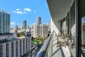 Private balcony with outdoor furniture.