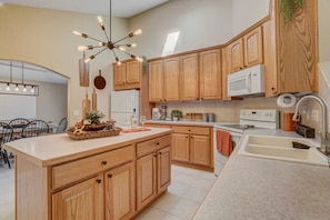 The large kitchen is spacious and complete with all major appliances and fully stocked with items to cook full meals!