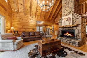 The living room beckons with its comfortable couch and inviting fireplace, creating an atmosphere of warmth and relaxation.