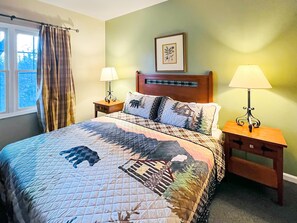 Master Bedroom with a KING mattress, chair and LCD Roku TV
