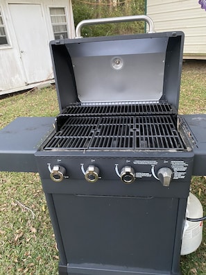 Gas grill at the backyard seating area