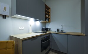 Kitchen with dishwasher, Nespresso, kettle, toaster, oven  and  microwave.