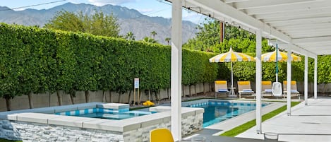 Luxurious 2600 sq ft backyard with pool, mountain views, and privacy amid ficus trees