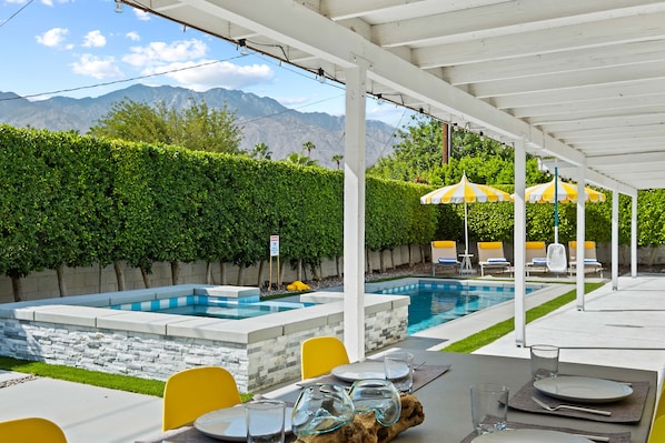 Luxurious 2600 sq ft backyard with pool, mountain views, and privacy amid ficus trees