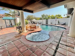 Covered spa and newly renovated saltwater pool.