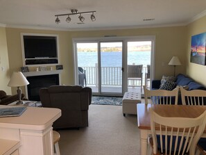 Great room with fireplace and smart TV.