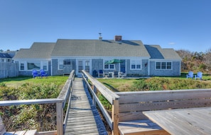 Back of the home with private stairway to the beach.