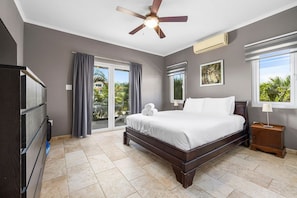 Bedroom 2 has a queen bed and a private attached bathroom
