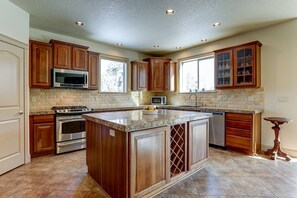 Spacious, open floorplan anchored by a gourmet kitchen.
