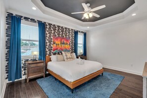Funky primary bedroom w/ tray ceiling & private balcony