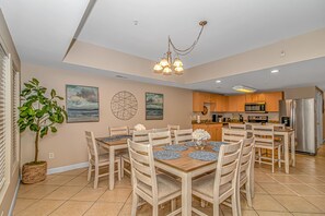 Kitchen dining space has settings for 16 guests.