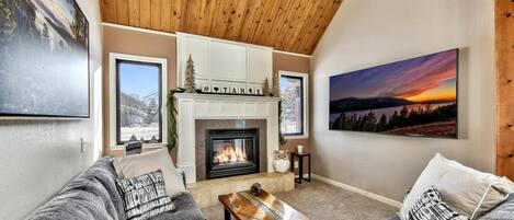 Cozy up next to the fireplace on the sectional seating 8.