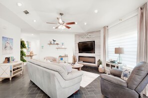 Living room with flat screen and fireplace