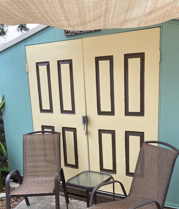 Private patio separated by a gate which enters into the large backyard.  