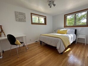 Queen room with desk; modern and light filled