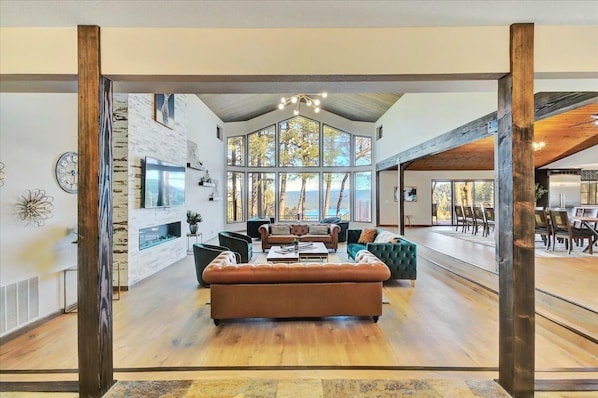 Living room with gorgeous lake view as you enter through the main door 