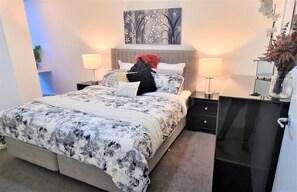King bed with luxury linen and comfy mattress.  Dedicated desk area
