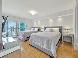 Bedroom featuring a 2 cozy Queen sized bed
