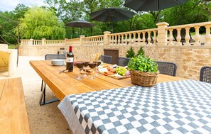 Large teak outdoor dining table