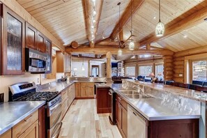 Custom kitchen with stainless steel counters. 