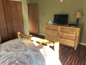 Master bedroom with tv.