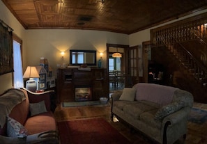 Living room with beautiful woodwork and fireplace 