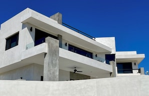 Front of 3-story villa with private front yard, jacuzzi, fp, rooftop deck