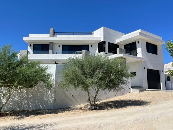 Front of 3-story villa with private front yard, jacuzzi, fp, rooftop deck