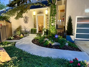 Pathway to front door. 2 car driveway. EV charging for 1.