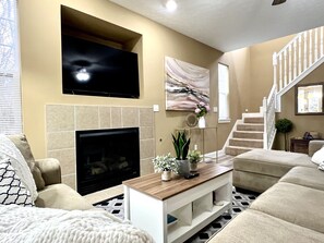 Family room and staircase to the second floor. 