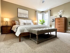 Primary second story bedroom with en suite bathroom and walk in closet. 