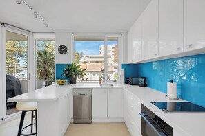 Even the kitchen has views of the beach and promenade