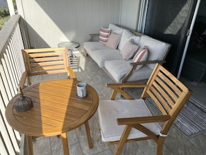 Large lanai with table for 2 and full sofa. 
